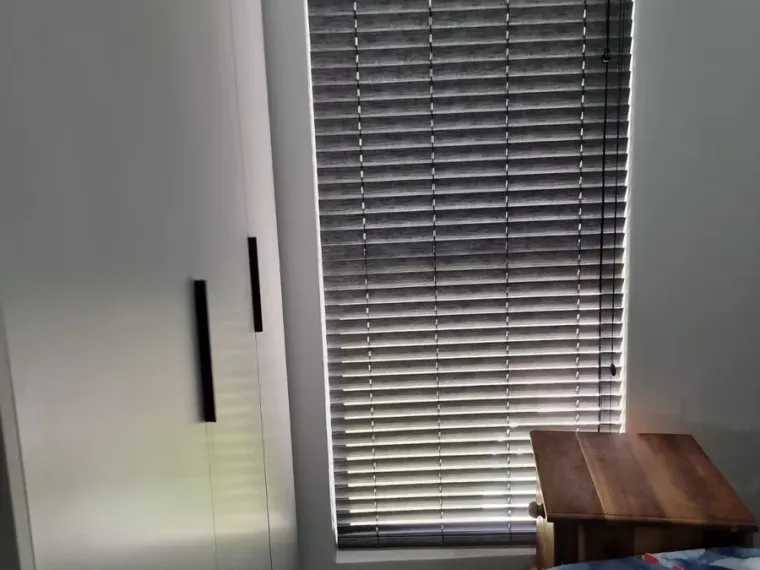 Charcoal venetian blinds fitted in a Cape Town bedroom