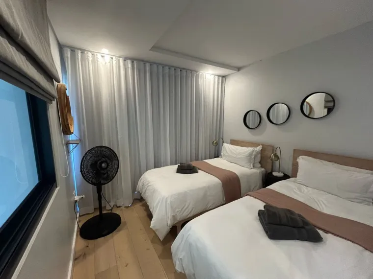 White wave curtains in a Cape Town twin bedroom