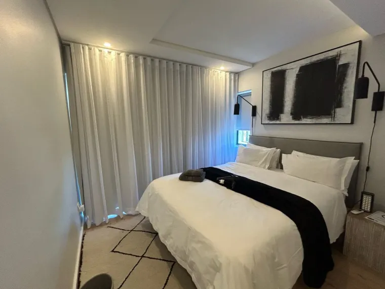 White wave curtains in a Cape Town master bedroom