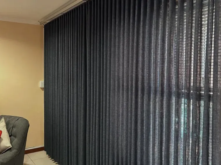 Navy vertical blinds installed in a Cape Town lounge