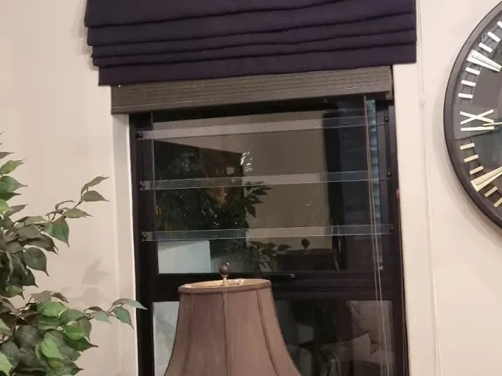 Navy roman blind in a Cape Town lounge